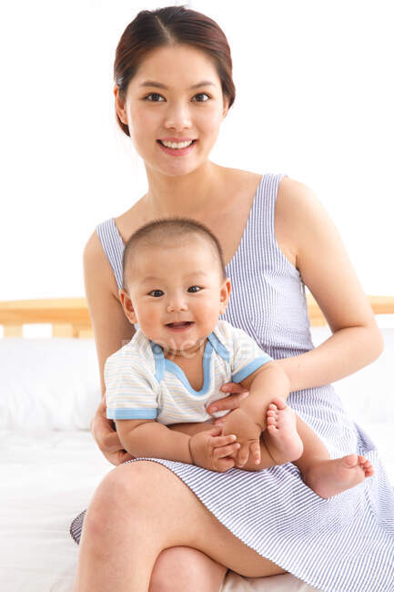 Mother holding a baby — Stock Photo