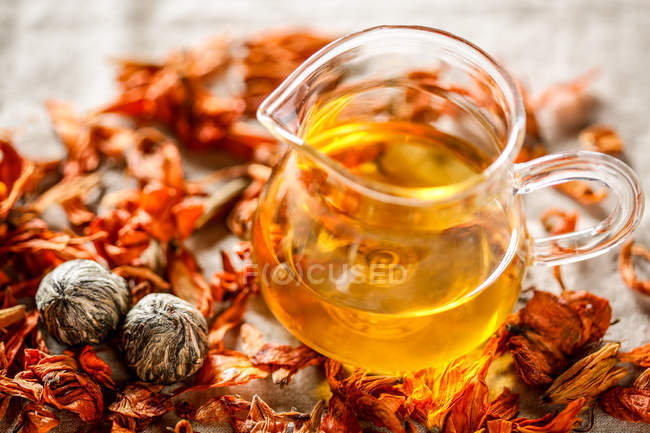 Close-up view of healthy organic herbal tea in glass jug — Stock Photo