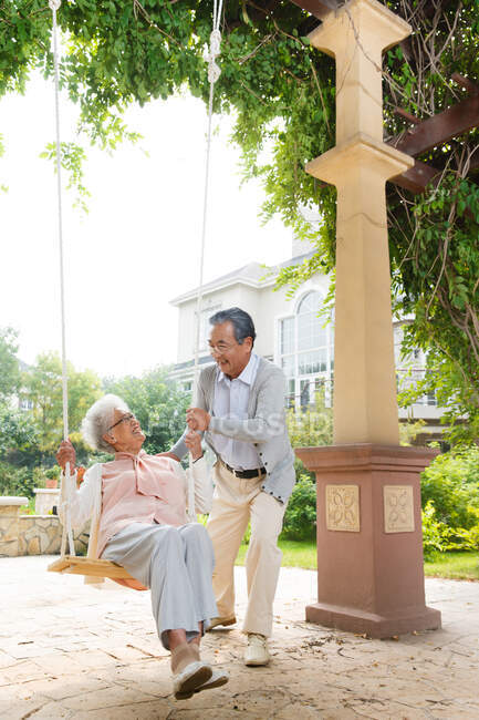 The old couple swing in outdoor — Stock Photo