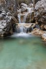 Small waterfalls of turquoise water in val Salet, Monti del Sole, National park Belluno Dolomites, Veneto, Italy — Stock Photo