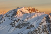 Europe, Italy, Veneto, Belluno. Mount Cernera (2657 m.) snow covered at sunset seen from the mountain Pore, Dolomites, Veneto, Italy — Stock Photo