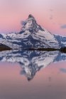 The Matterhorn at sunrise reflected at Stellisee, Zermatt, Canton of Valais, Switzerland, Europe — Stock Photo