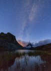 Stars and Milky Way above Lake Stellisee, Zermatt, Canton of Valais landscape, Switzerland, Europe — Stock Photo