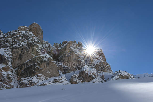 The sun rises behind the peaks of Piciodel, Fanes, Fanes-Sennes-Prags Nature Park, Dolomites, Trentino-Alto Adige, Italy — Stock Photo