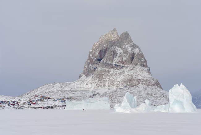 Uummannaq during winter in northern Greenland, seen from the frozen fjord. America, North America, Denmark, Greenland — Stock Photo