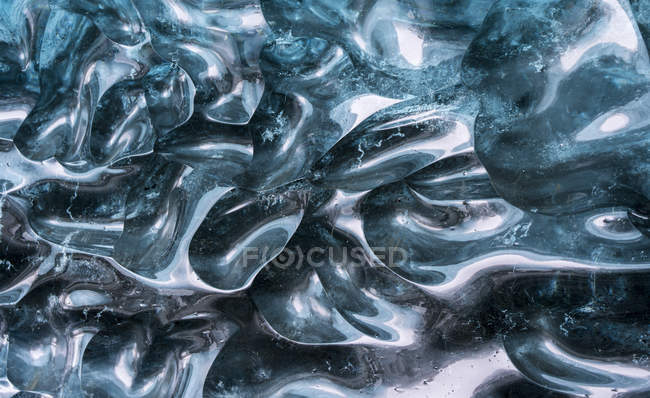 Glacial cave in the Breidamerkurjoekull Glacier in Vatnajoekull National Park. details of patterns created by the melting process. europe, northern europe, iceland,  February — Stock Photo