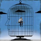 Depressed man inside head-shaped birdcage — Stock Photo
