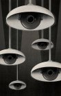 CCTV eyes under lampshades peeking — Stock Photo