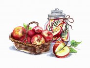 Яблоки в корзине и банке — стоковое фото