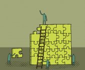 Workers building yellow puzzle — Stock Photo