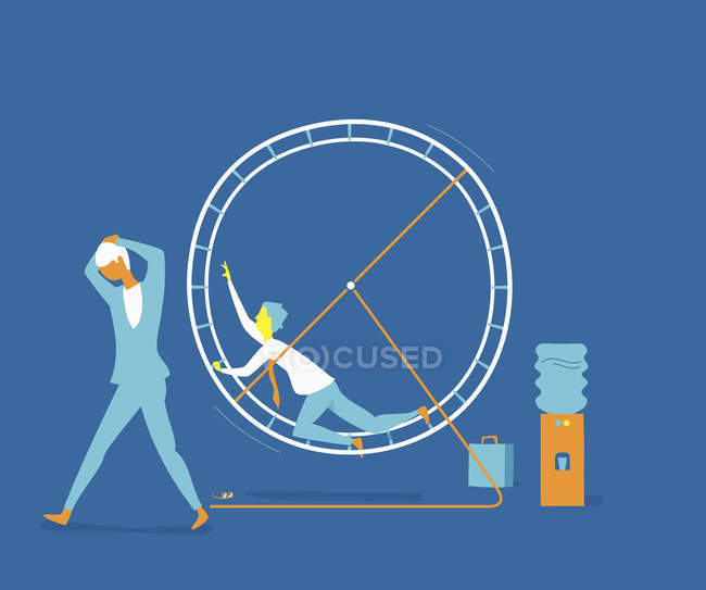 Exhausted businessman in exercise wheel next to businesswoman — Stock Photo