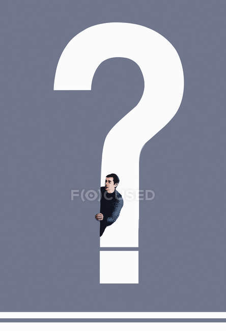 Man looking out from question mark — Stock Photo