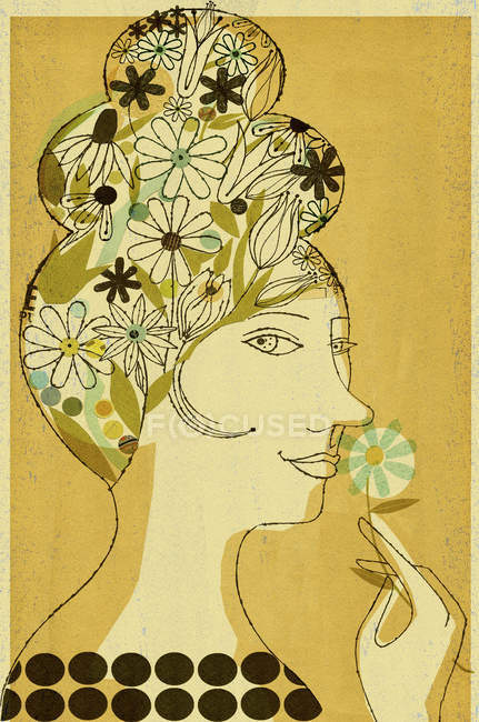 Frau mit Blumen im Haar, die nach Blüte riechen — Stockfoto