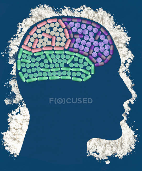Pills inside head outlined with powder — Stock Photo