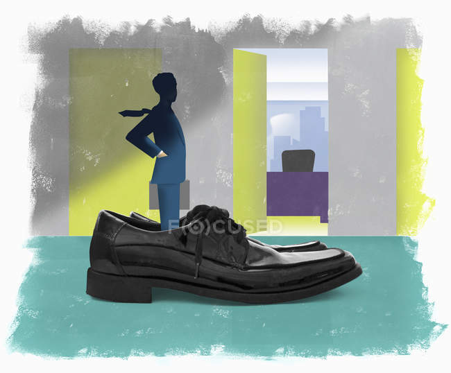 Businessman standing in oversized shoes — Stock Photo