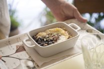Gratin barley, quinoa and beans with cheese in porcelain dish. — Stock Photo