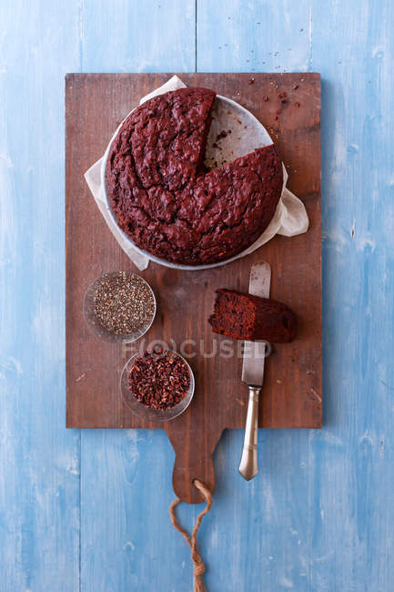 Homemade chocolate chia seed cake served on wooden board — Stock Photo