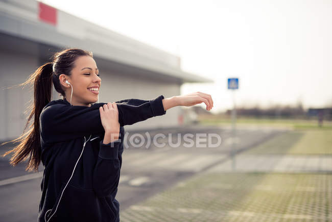 Stretching her muscles — Stock Photo