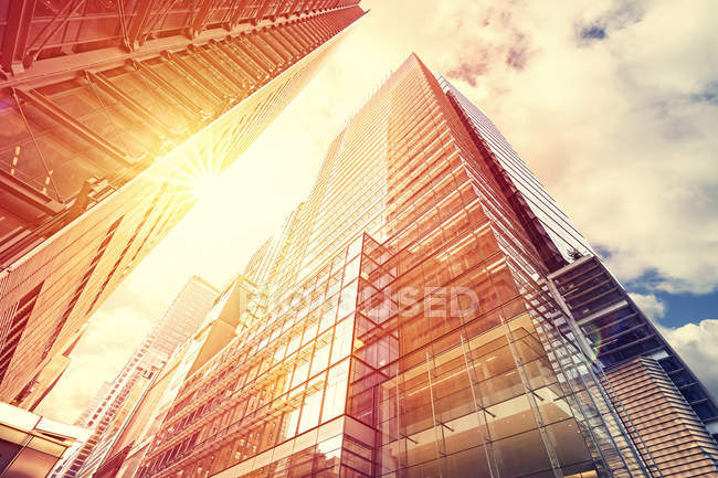 Vintage toned sunset over skyscrapers, business background. — Stock Photo