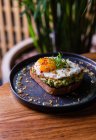Closeup view of toast with guacamole and egg — Stock Photo