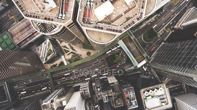 Top view aerial photo from flying drone of a tall skyscrapers with contemporary design, road with cars. — Stock Photo