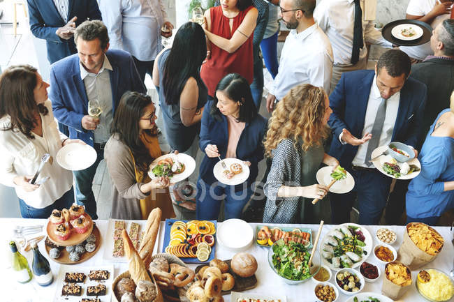 Diversity people eating reception food — Stock Photo