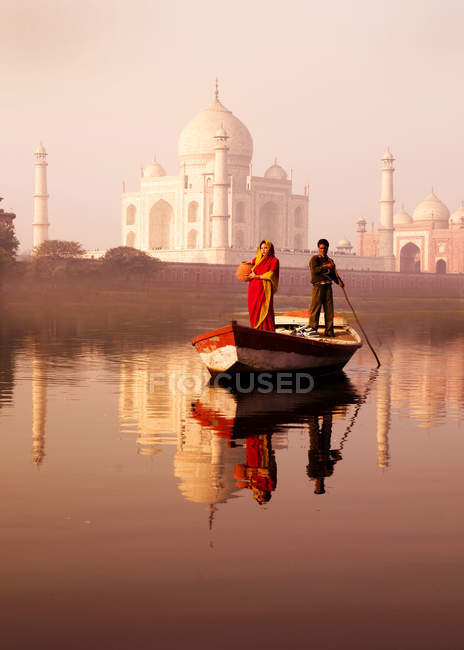 Indian man and woman on boat — Stock Photo