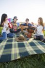 Chinese friends playing music instruments at music festival — Stock Photo