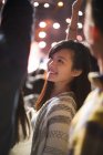 Chinese woman smiling at music festival — Stock Photo