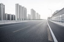 Urban scene of road and modern architecture in China — Stock Photo