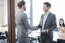 Business people shaking hands after meeting — Stock Photo