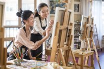 Asian women painting in art studio — Stock Photo