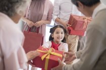 Family visiting with gifts on Chinese new year — Stock Photo