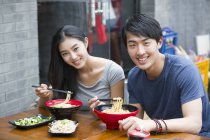Chinese couple having lunch — Stock Photo