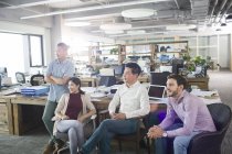 Architects sitting in office and looking away — Stock Photo