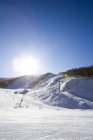 Scenic view of ski lift at winter resort — Stock Photo