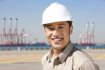 Chinese shipping industry worker in shipping dock, portrait — Stock Photo