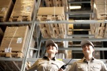 Male and female Chinese warehouse workers — Stock Photo