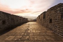 Scenic view of Great Wall of China on sunset — Stock Photo
