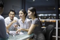 Chinese business team talking in meeting — Stock Photo