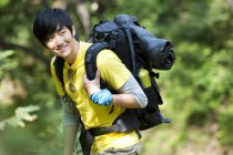Chinese male hiker in woods — Stock Photo
