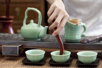 Close-up of woman performing classic tea ceremony — Stock Photo