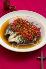 Chinese traditional chili fish head dish — Stock Photo