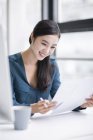 Chinese businesswoman working in office — Stock Photo