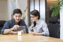 Chinese developers working with transparent models in office — Stock Photo