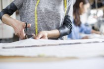 Cropped view of fashion designers working in studio — Stock Photo