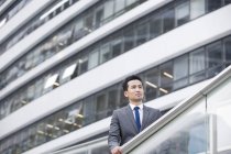 Chinese businessman looking at view and thinking — Stock Photo