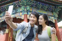 Chinese couple taking selfie in Lama Temple — Stock Photo
