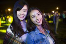 Chinese women standing at music festival — Stock Photo