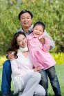 Portrait of a young Chinese family — Stock Photo
